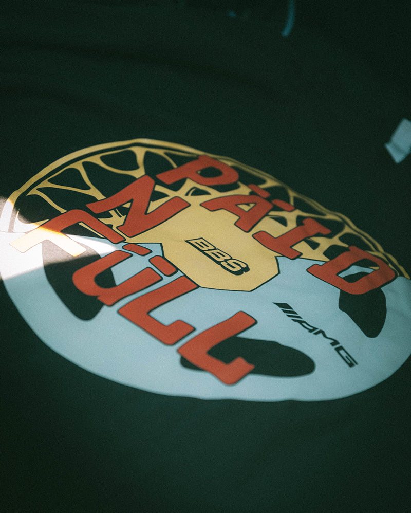 Black shirt with 'PAID IN FULL' wheel graphic, BBS and AMG streetwear design.