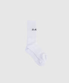 White crew socks with "It Me" black text embroidery, streetwear apparel on white background