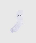 White crew socks with black text embroidery, men's streetwear apparel on plain background