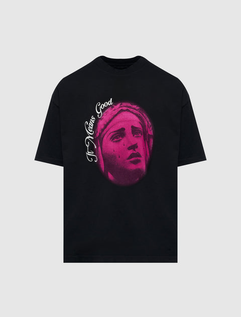 Black streetwear t-shirt with pink statue face graphic and 'It Means Good' text