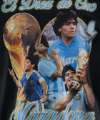 Black streetwear shirt featuring soccer legend collage, World Cup trophy, and a dove graphic.