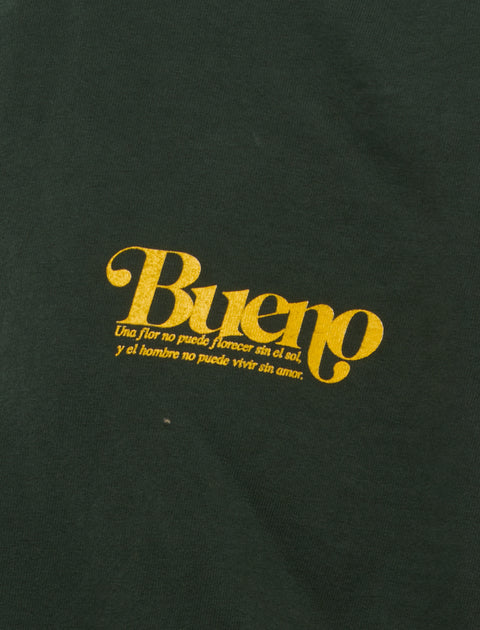 Dark green streetwear t-shirt with yellow Bueno script and Spanish quote graphic detail
