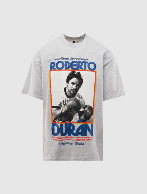 Gray streetwear t-shirt with bold graphic of boxer, vintage sports-inspired design, short sleeve