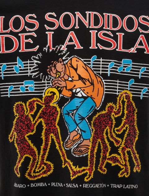 Illustrated graphic tee with trumpet player, music notes, red outlined dancers, and Spanish text.