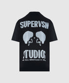 Black short sleeve streetwear t-shirt with bold white 'SUPERVSN STUDIOS' graphic on back.