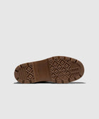 Brown rubber sneaker sole with textured tread pattern on a light background