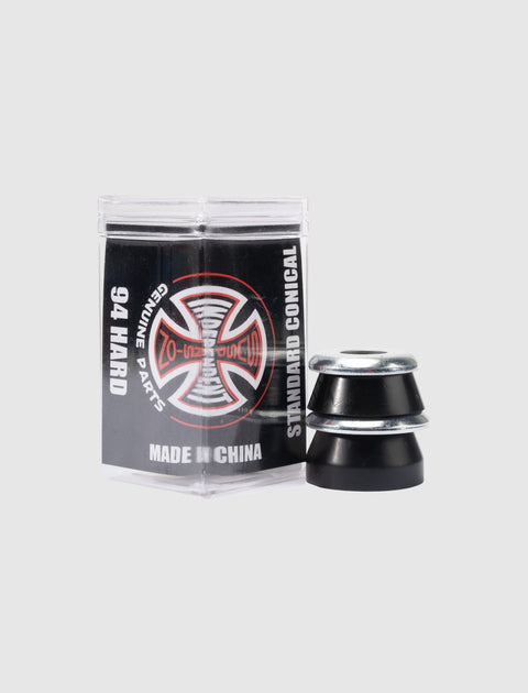 Black skateboard bushings and washers with branded packaging on a light background