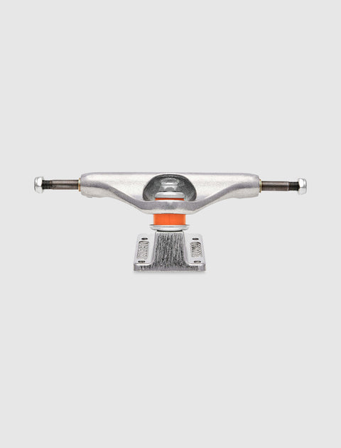 Silver skateboard truck with orange bushing on a plain white background