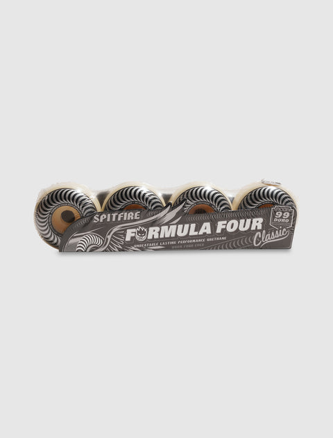 Pack of Spitfire Formula Four Classic 99 duro skateboard wheels on plain background