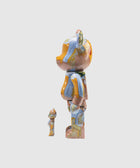 Two colorful bear-shaped collectible toys with abstract patterns, side view on white background.