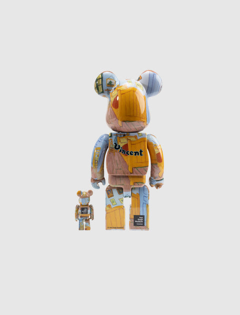 Two collectible bear-shaped art toys with colorful paint and 'Vincent' text, standing on white background