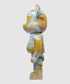 Side view of collectible bearbrick toy with Van Gogh-inspired art print pattern