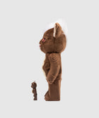 Side view of two brown plush and vinyl collectible figures, one large and one small, on a gray background.