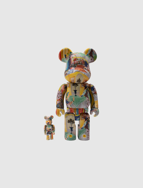 Two multicolor Bearbrick art collectible figures with collage graphic prints on white background