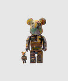 Two Bearbrick art collectible figures with colorful graphic designs on a plain background