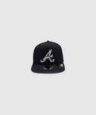 Black fitted cap with embroidered letter A and crab design on front, gold sticker on brim