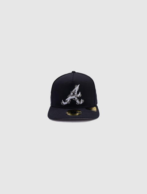 Black fitted cap with embroidered letter A and crab design on front, gold sticker on brim
