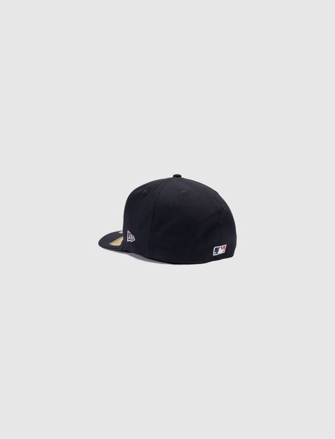 Black fitted baseball cap with New Era and MLB logo, side and back view on white background