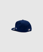 Navy blue fitted baseball cap with MLB logo, side and rear view on light background