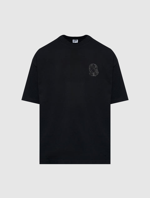 Black men's streetwear t-shirt with small astronaut graphic on chest, flat lay