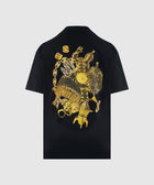 Black streetwear tee with bold gold graphic of watch, chains, and luxury accessories on back