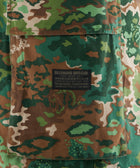 Green and brown camo cargo pocket with Billionaire Boys Club label patch