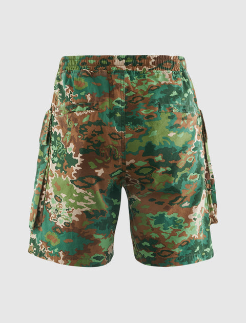 Back view of green and brown camo cargo shorts with side pockets, men's streetwear style