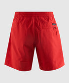 Back view of red men’s streetwear shorts with elastic waistband and zip pocket