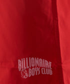 Close-up of red fabric with Billionaire Boys Club logo print and detailed stitching
