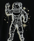 Graphic print of astronaut in space suit with stars on black fabric