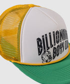 Yellow mesh and green brim trucker hat with graphic text and cartoon astronaut on front panel