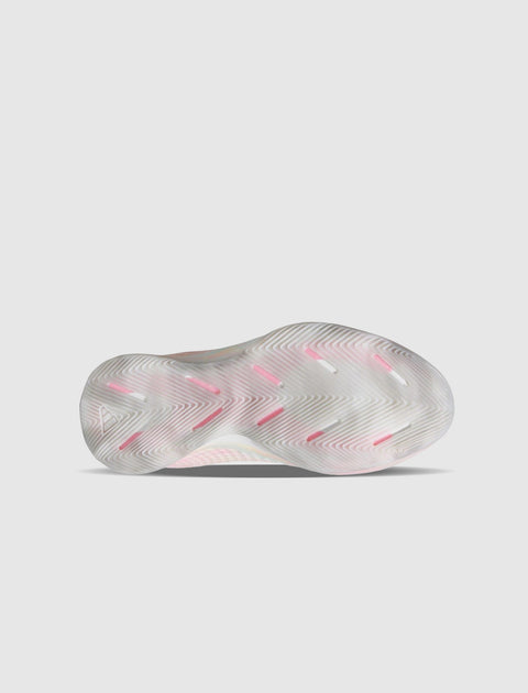 Translucent sneaker outsole with pink and white herringbone traction pattern