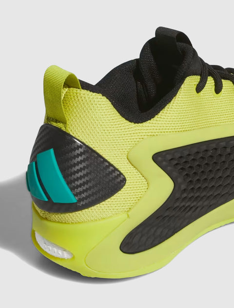 Men's streetwear sneaker in lime green and black with mesh upper and blue heel detail