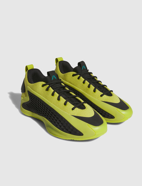 Lime green and black low-top sneakers with mesh uppers and modern streetwear design