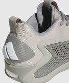 Close-up of a grey mesh athletic sneaker with textured heel and side panel details