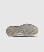 Grey sneaker outsole with herringbone tread pattern on white background