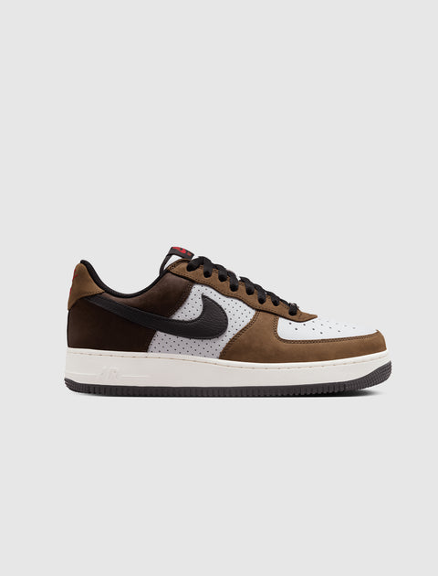 Brown and white men's low-top sneaker with black swoosh, perforated leather, streetwear style