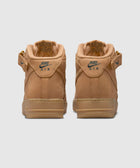 Tan Nike Air Force 1 Mid sneakers rear view, gum sole, suede finish, classic streetwear shoes