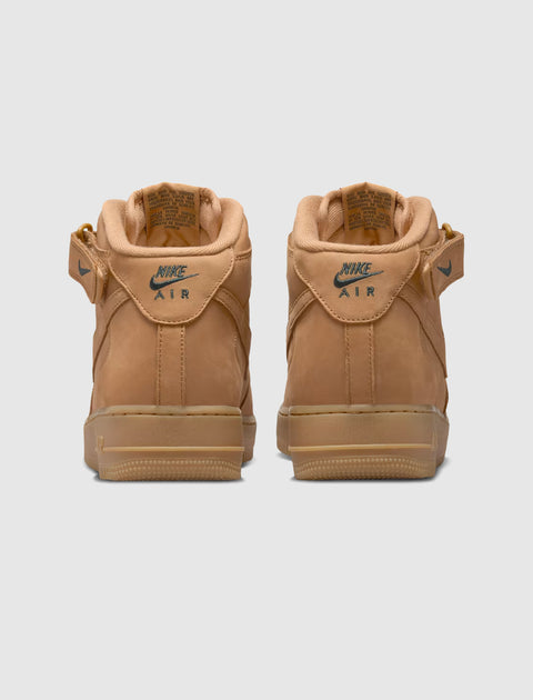 Tan Nike Air Force 1 Mid sneakers rear view, gum sole, suede finish, classic streetwear shoes
