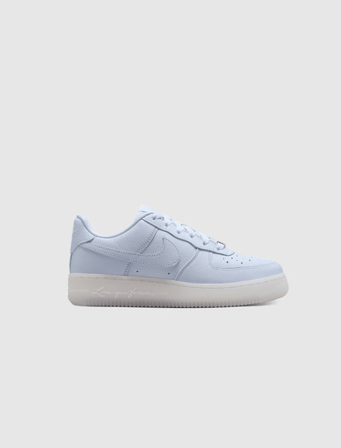 Pale purple low-top sneaker with leather upper, translucent sole, and side logo on white background