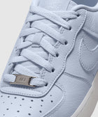 Close-up of pale purple Nike Air Force 1 sneaker with textured leather and white laces