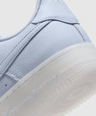Close-up of pastel purple sneaker heel with 'Love you forever' text and textured sole