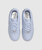 Light purple Nike Air Force 1 sneakers with silver NOCTA insoles, top view