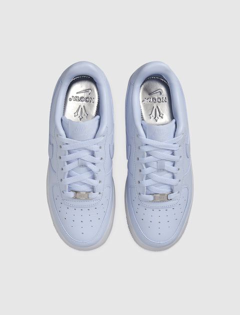 Light purple Nike Air Force 1 sneakers with silver NOCTA insoles, top view
