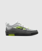 Men's low-top sneaker in white, gray, and neon green with visible air sole and side logo