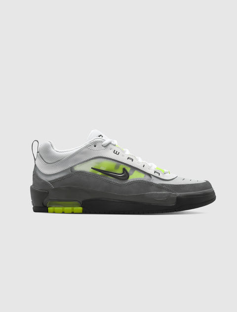 Men's low-top sneaker in white, gray, and neon green with visible air sole and side logo