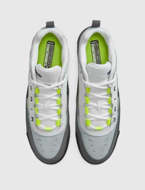 Top view of grey and white athletic sneakers with neon yellow accents and white laces