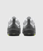Rear view of grey and white Nike SB sneakers with lime accents on heel
