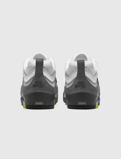 Rear view of grey and white Nike SB sneakers with lime accents on heel