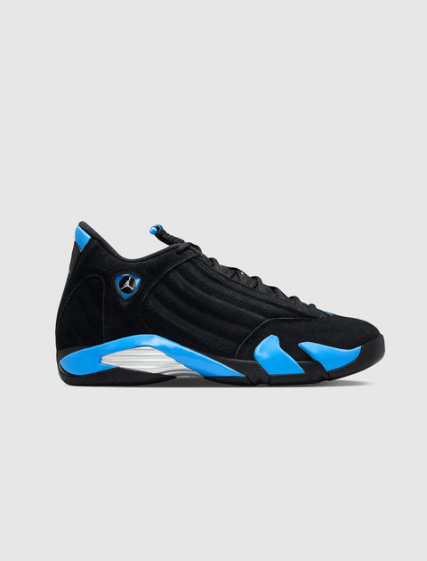 Black and blue athletic sneaker with suede upper and silver detailing on a white background